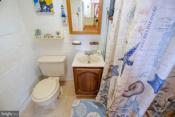 a bathroom with a toilet and a sink
