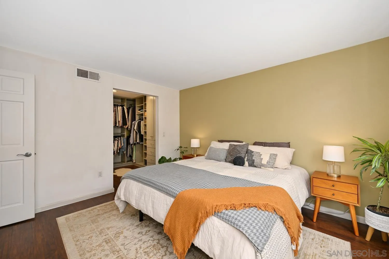 1270 Cleveland Avenue, Unit F246 San Diego, CA 92103 - Photo 12 of 23 a bedroom with a bed and a couch