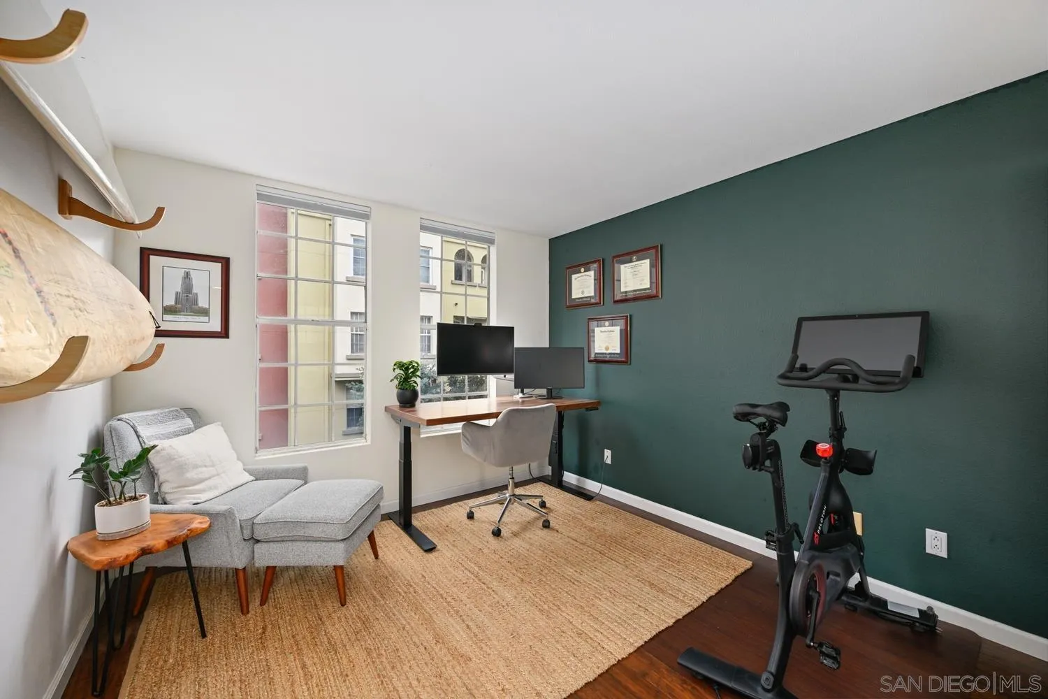 1270 Cleveland Avenue, Unit F246 San Diego, CA 92103 - Photo 17 of 23 a work room with furniture a rug and a window