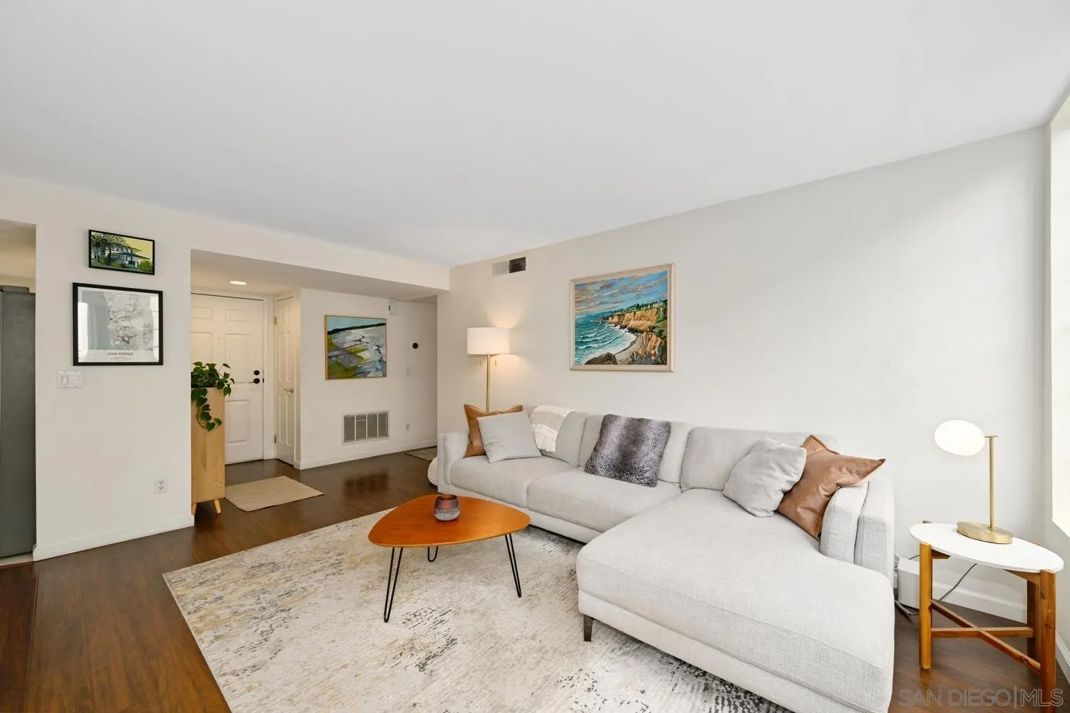 1270 Cleveland Avenue, Unit F246 San Diego, CA 92103 - Photo 3 of 23 a living room with furniture and wooden floor