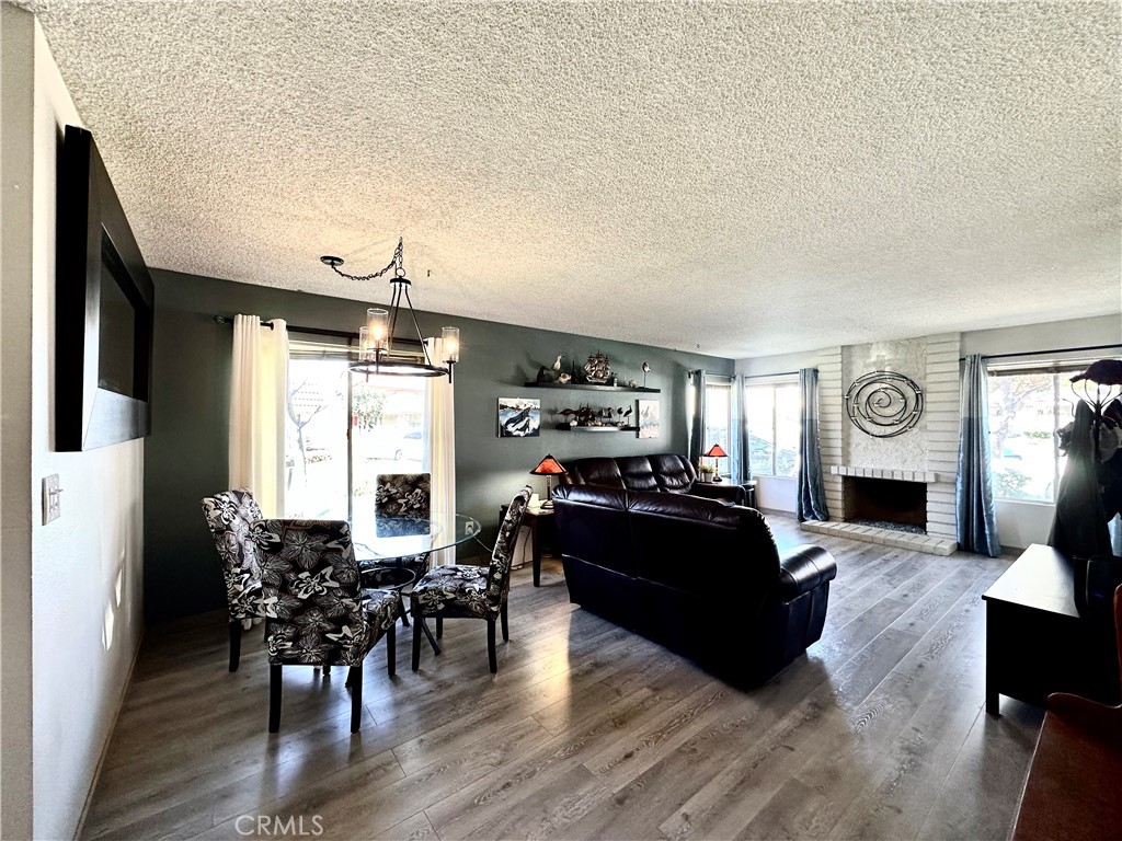 a living room with furniture fireplace and flat screen tv