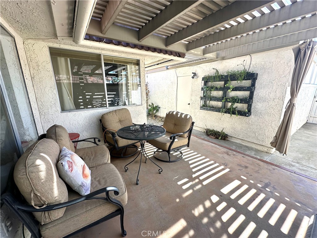 6612 Southampton Drive Cypress, CA 90630 - Photo 22 of 27 a living room with furniture and a window