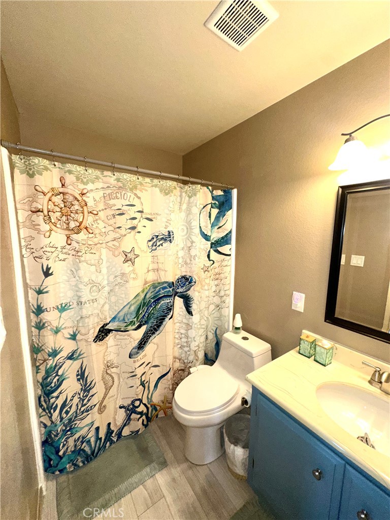6612 Southampton Drive Cypress, CA 90630 - Photo 9 of 27 a bathroom with a sink toilet and shower