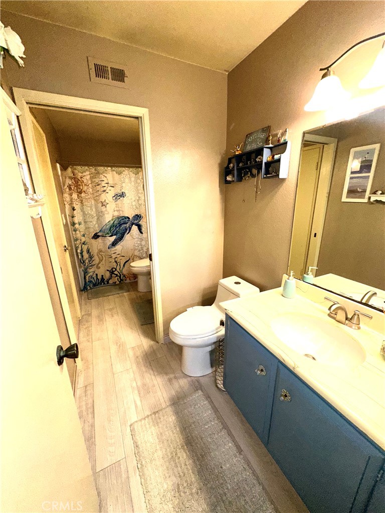 6612 Southampton Drive Cypress, CA 90630 - Photo 10 of 27 a spacious bathroom with a granite countertop sink mirror vanity and toilet