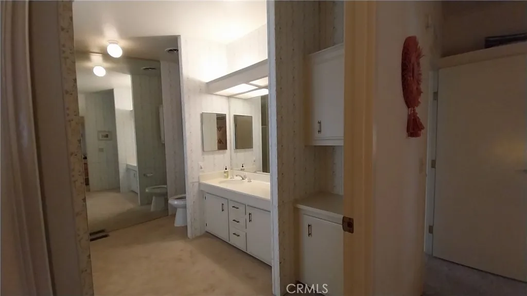 205 Thunderbird Lane, Unit 2 Needles, CA 92363 - Photo 15 of 71 a bathroom with a shower and a sink