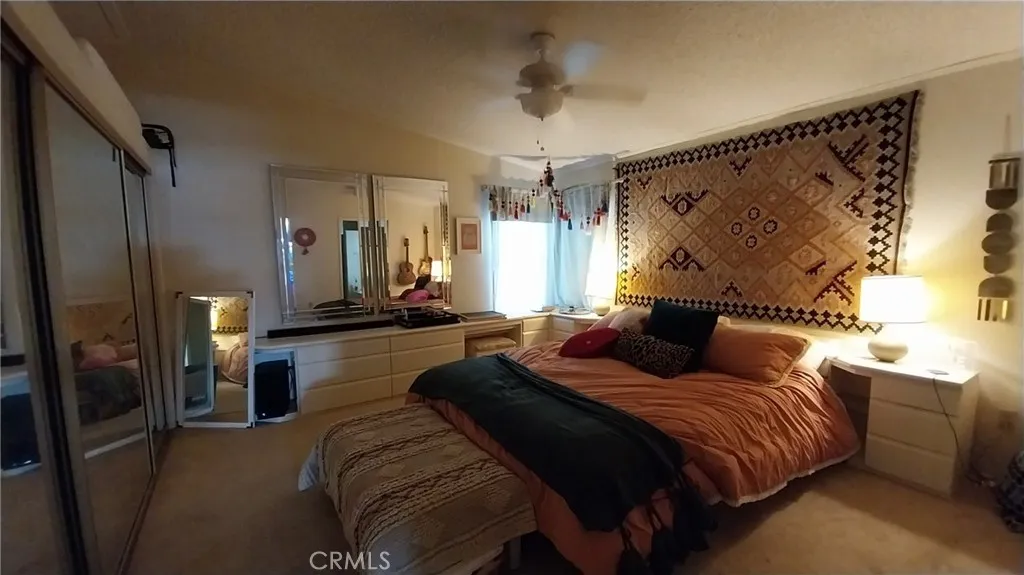 205 Thunderbird Lane, Unit 2 Needles, CA 92363 - Photo 17 of 71 a bedroom with double bed and a window