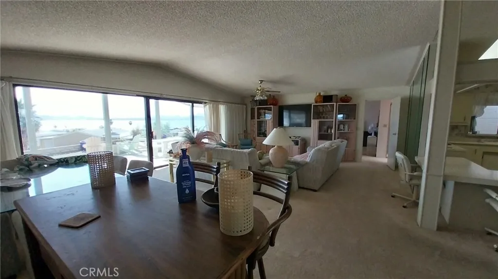 205 Thunderbird Lane, Unit 2 Needles, CA 92363 - Photo 31 of 71 a living room with furniture and a large window