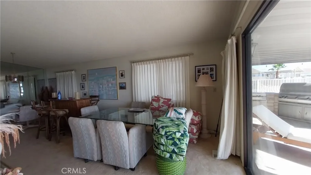 205 Thunderbird Lane, Unit 2 Needles, CA 92363 - Photo 44 of 71 a living room with furniture and a window