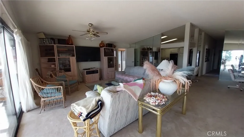 205 Thunderbird Lane, Unit 2 Needles, CA 92363 - Photo 45 of 71 a living room with furniture a flat screen tv and a fireplace