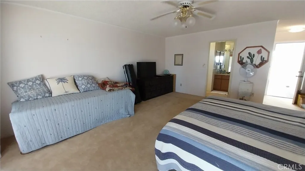 205 Thunderbird Lane, Unit 2 Needles, CA 92363 - Photo 53 of 71 a bedroom with furniture and a window