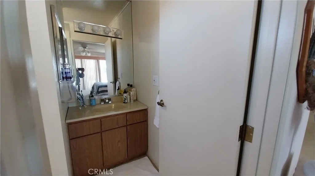 205 Thunderbird Lane, Unit 2 Needles, CA 92363 - Photo 56 of 71 a bathroom with a sink a toilet and mirror