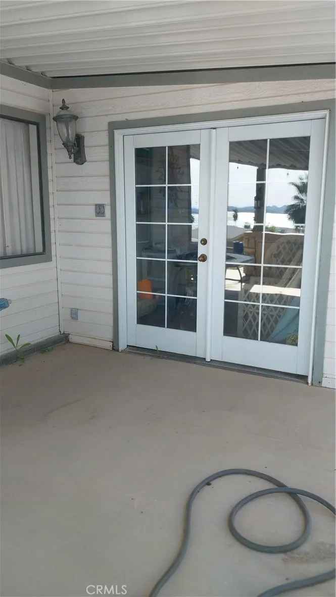 205 Thunderbird Lane, Unit 2 Needles, CA 92363 - Photo 61 of 71 a view of wooden floor and windows in a room