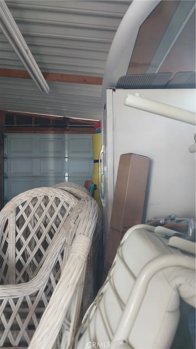 205 Thunderbird Lane, Unit 2 Needles, CA 92363 - Photo 63 of 71 a bedroom with a bed and a mirror