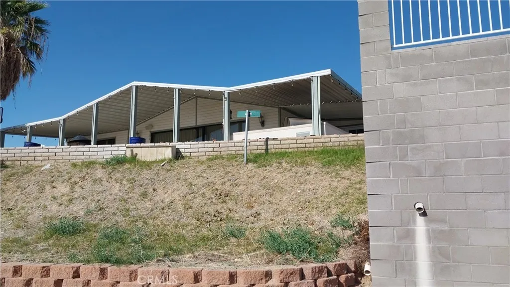 205 Thunderbird Lane, Unit 2 Needles, CA 92363 - Photo 65 of 71 a backyard of a house with barbeque oven