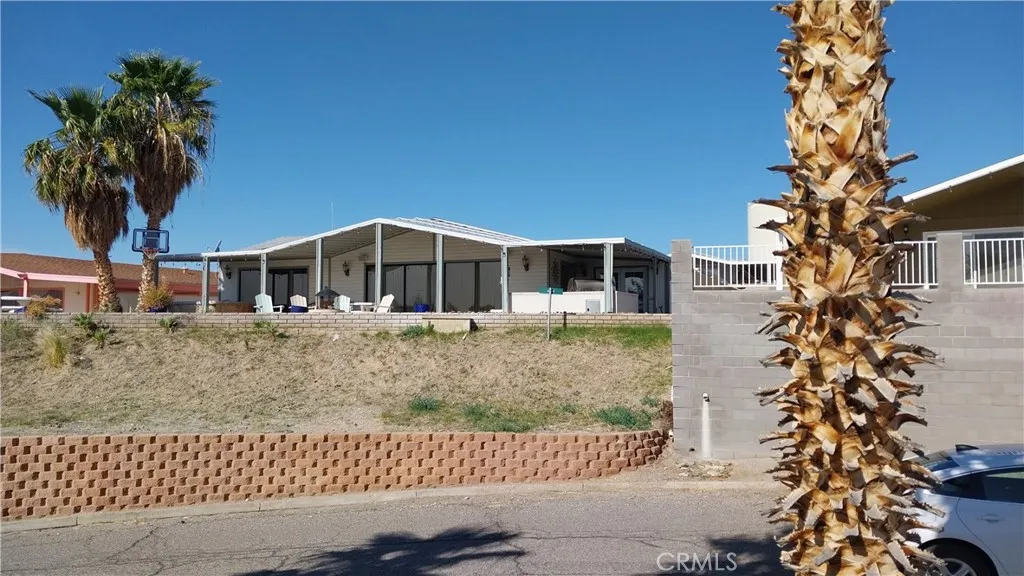 205 Thunderbird Lane, Unit 2 Needles, CA 92363 - Photo 66 of 71 front view of a house with a garden