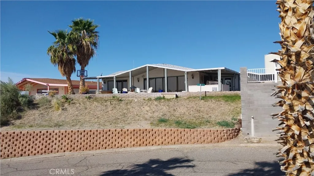 205 Thunderbird Lane, Unit 2 Needles, CA 92363 - Photo 67 of 71 front view of a house with a yard