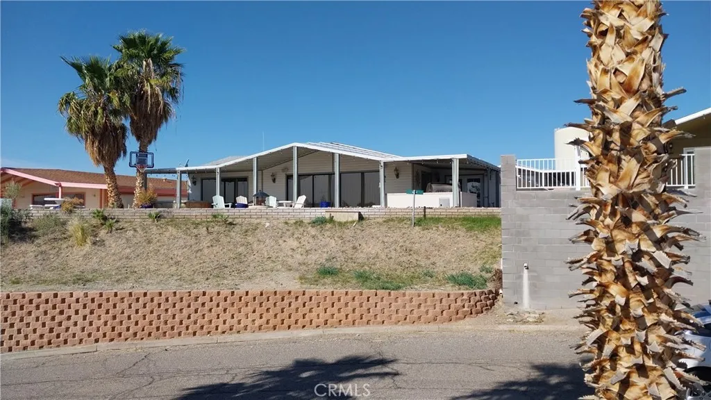 205 Thunderbird Lane, Unit 2 Needles, CA 92363 - Photo 68 of 71 front view of a house with a garden