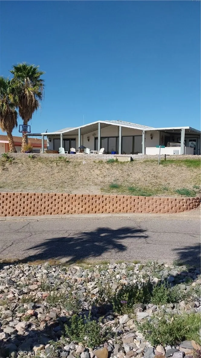 205 Thunderbird Lane, Unit 2 Needles, CA 92363 - Photo 69 of 71 a view of a house with a yard