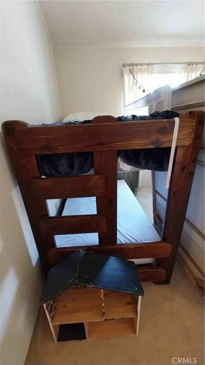 205 Thunderbird Lane, Unit 2 Needles, CA 92363 - Photo 9 of 71 a living room with furniture and a window