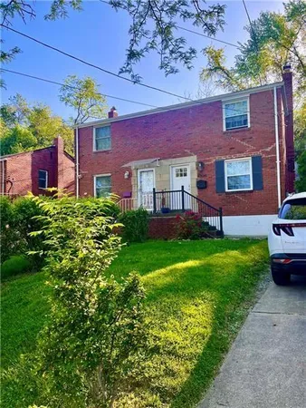 a view of a house with a garden