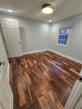 wooden floor in a hall with an entryway