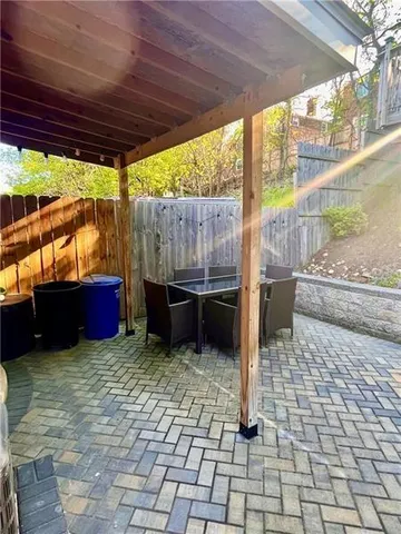 a view of a chairs and fire pit in the patio