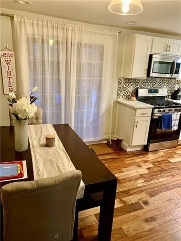 a living room with a fireplace furniture and a window