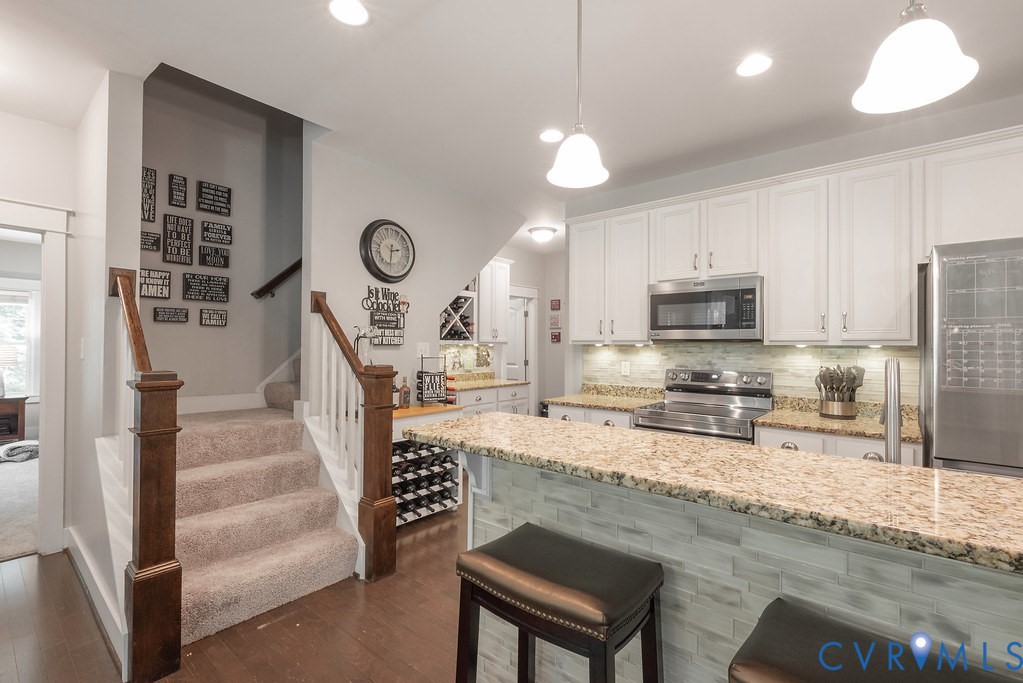 6446 Chestnut Church Road Mechanicsville, VA 23116 - Photo 13 of 49 Kitchen featuring white cabinetry, stainless steel