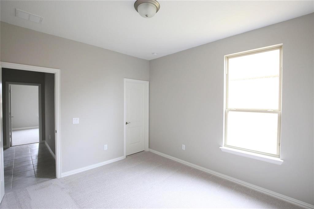 15142 Rosario Road Frisco, TX 75035 - Photo 16 of 21 Room featuring neutral wall tones and light-toned carpeting
