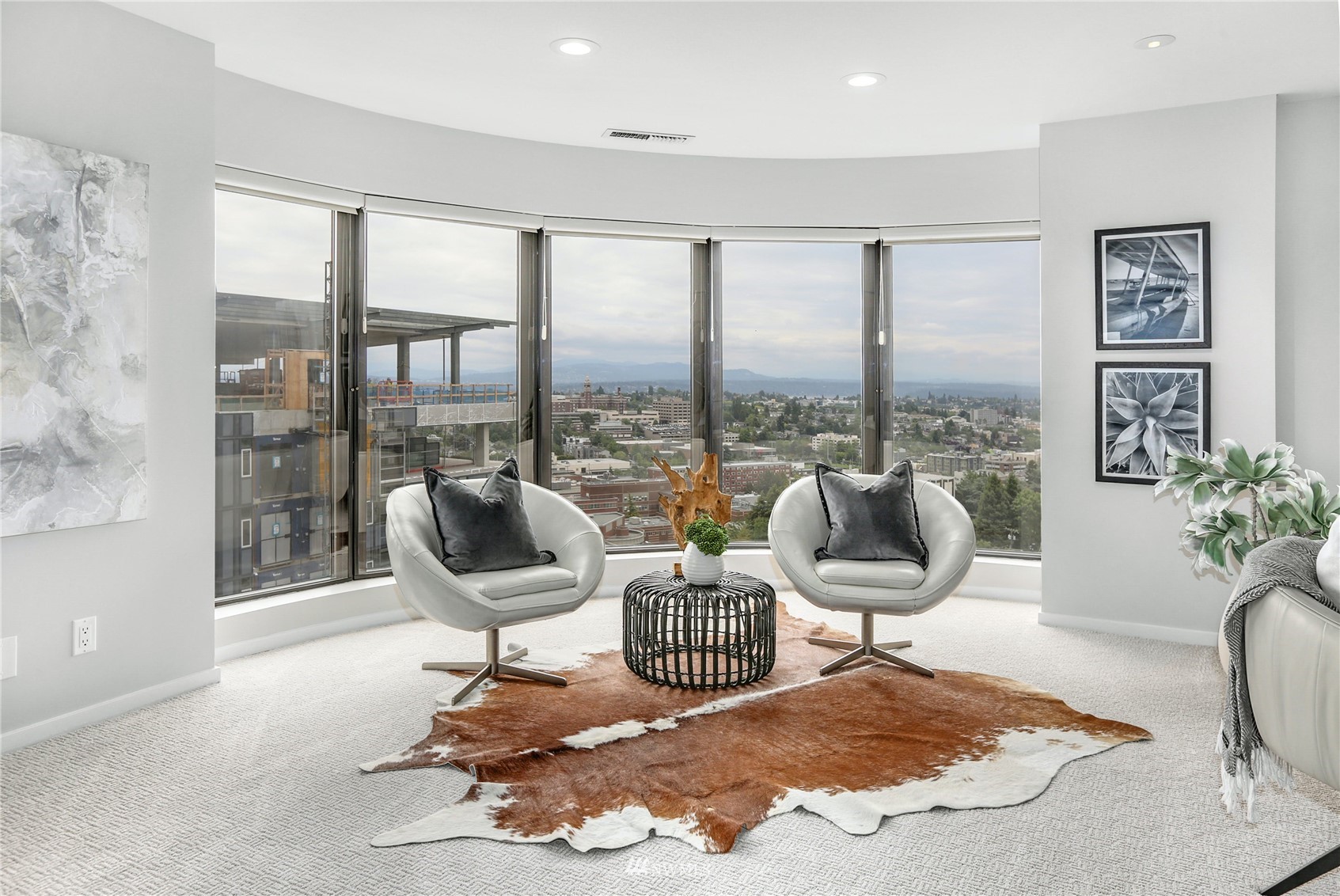 1301 Spring Street, Unit 18H Seattle, WA 98104 - Photo 15 of 38 a living room with furniture and a floor to ceiling window