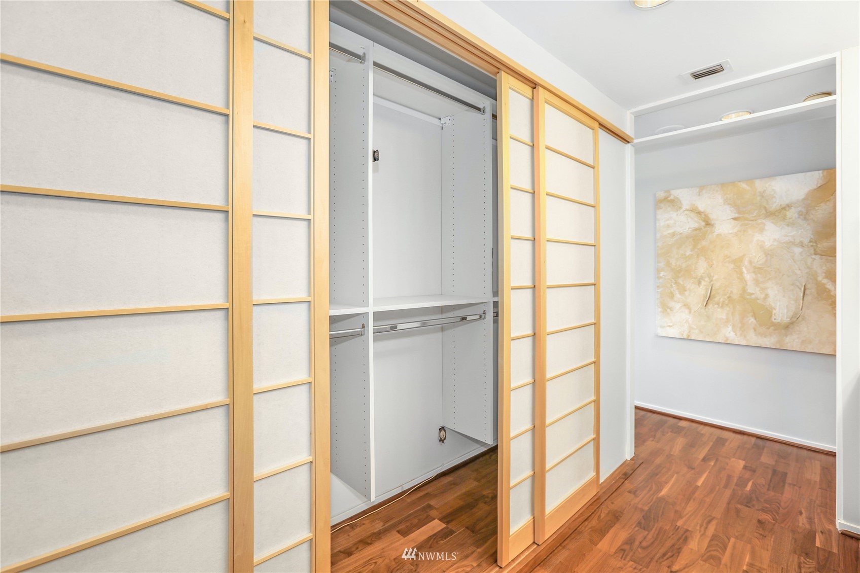 1301 Spring Street, Unit 18H Seattle, WA 98104 - Photo 22 of 38 a view of a window and an empty room with wooden floor