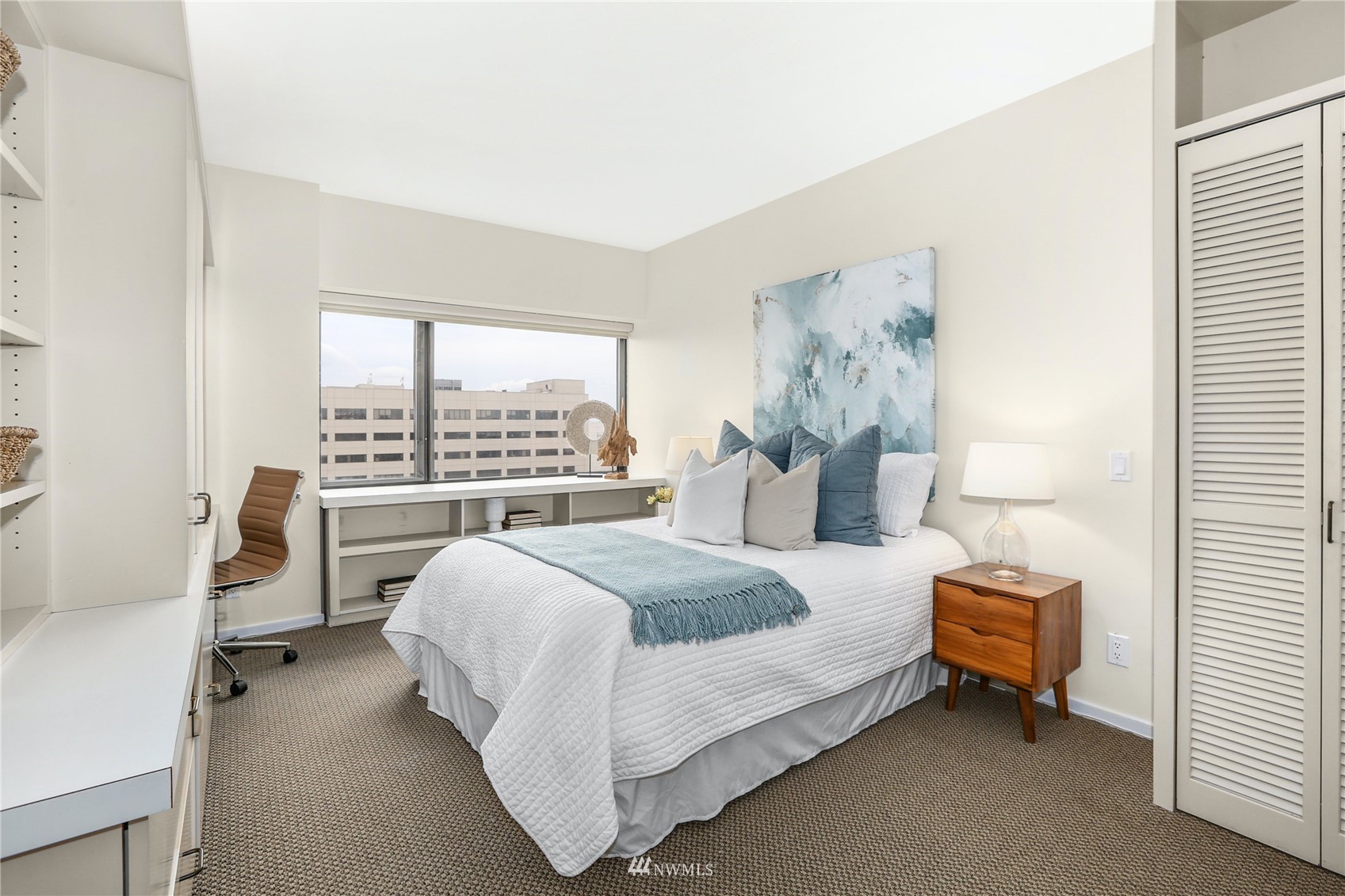 1301 Spring Street, Unit 18H Seattle, WA 98104 - Photo 25 of 38 a bedroom with a bed and window