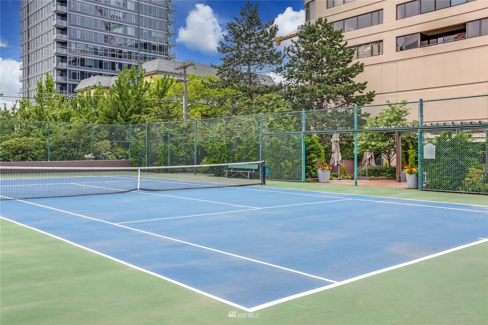 1301 Spring Street, Unit 18H Seattle, WA 98104 - Photo 31 of 38 a view of a tennis court