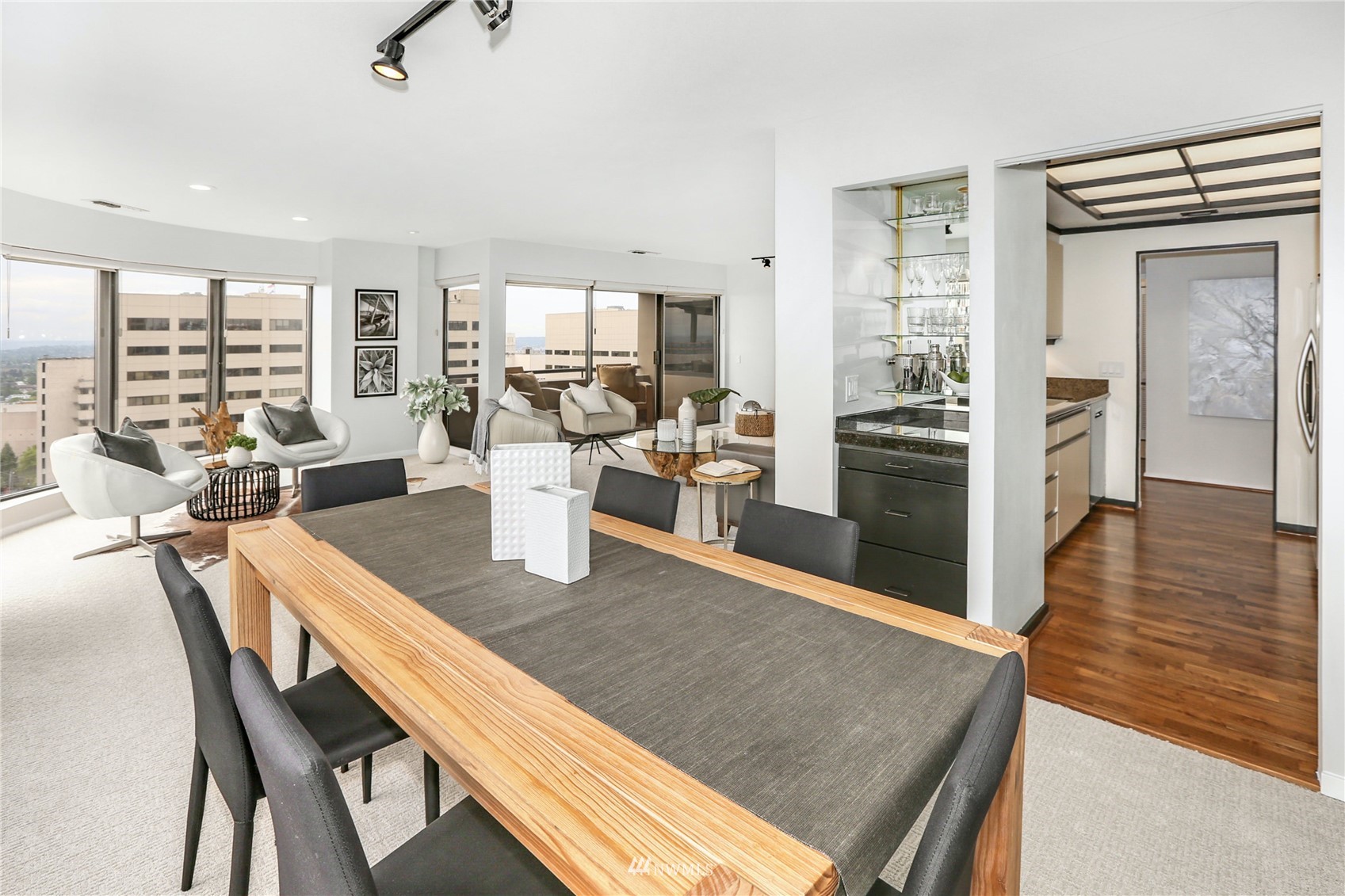 1301 Spring Street, Unit 18H Seattle, WA 98104 - Photo 7 of 38 a large kitchen with a table and chairs