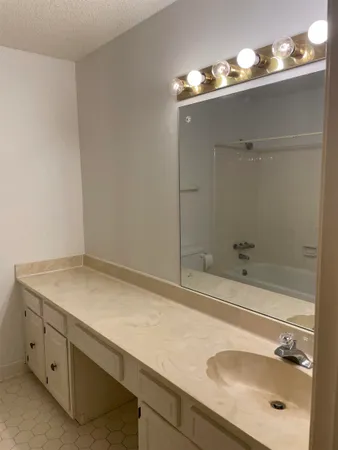 a bathroom with a toilet and a bathtub