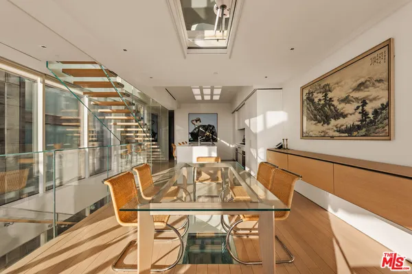 a living room with furniture and a book shelf