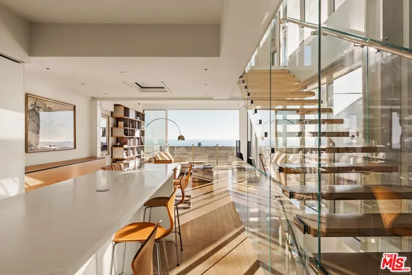 a view of a kitchen with a sink and cabinets