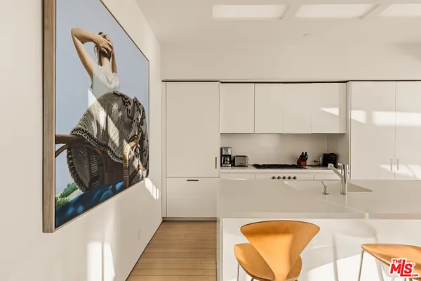 a kitchen with a large window and a table