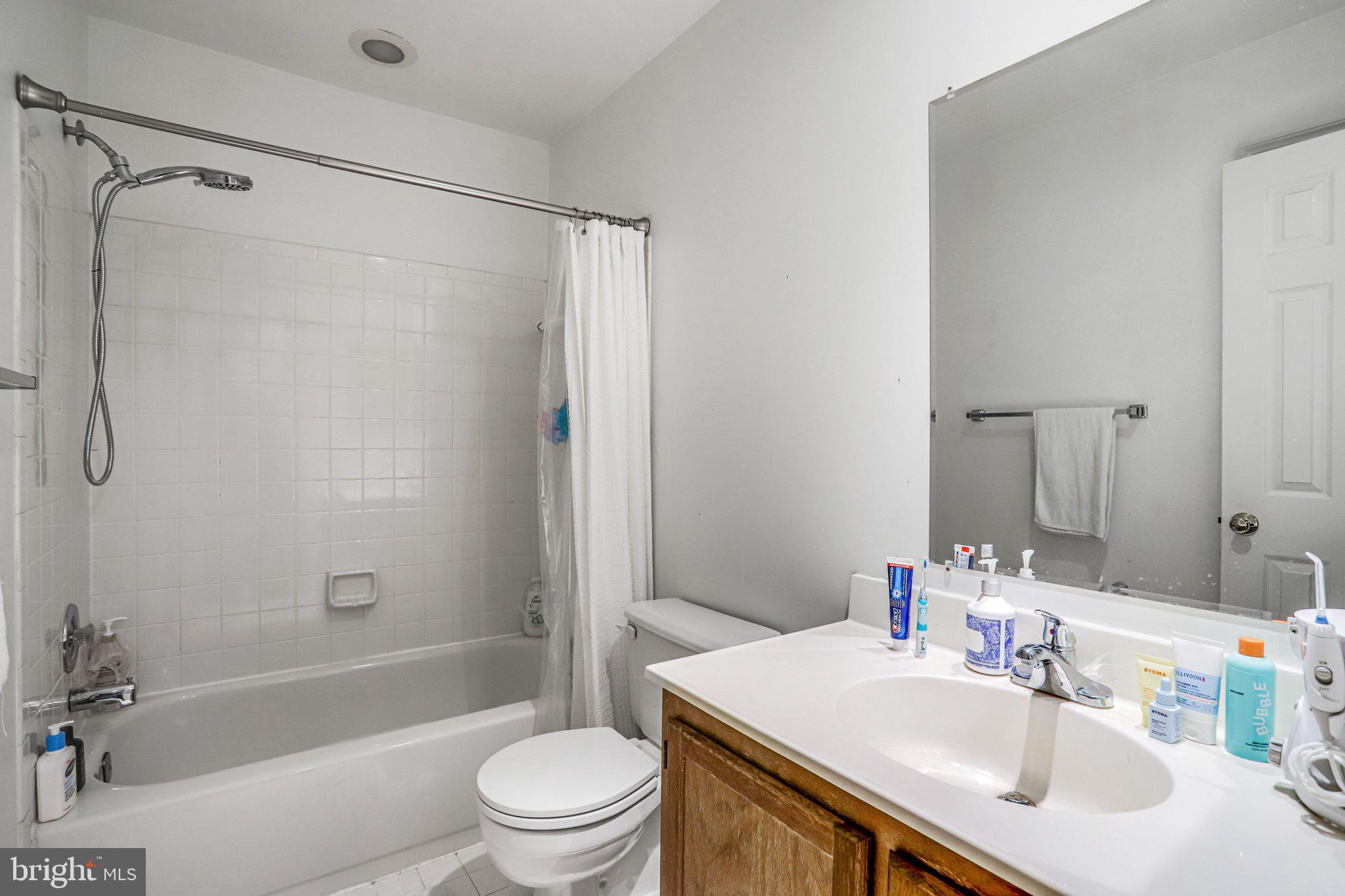 17303 Buehler Road Olney, MD 20832 - Photo 11 of 14 a bathroom with a sink toilet and shower