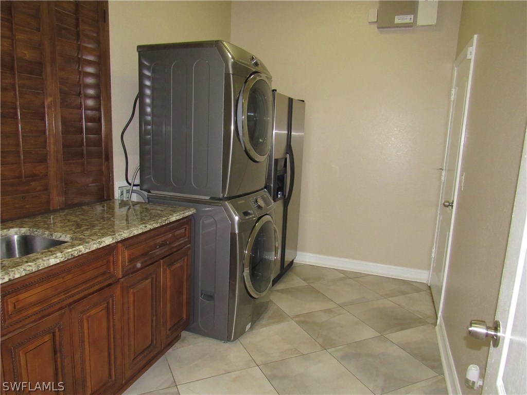 31031 Oil Well Road Punta Gorda, FL 33955 - Photo 17 of 22 a utility room with cabinets