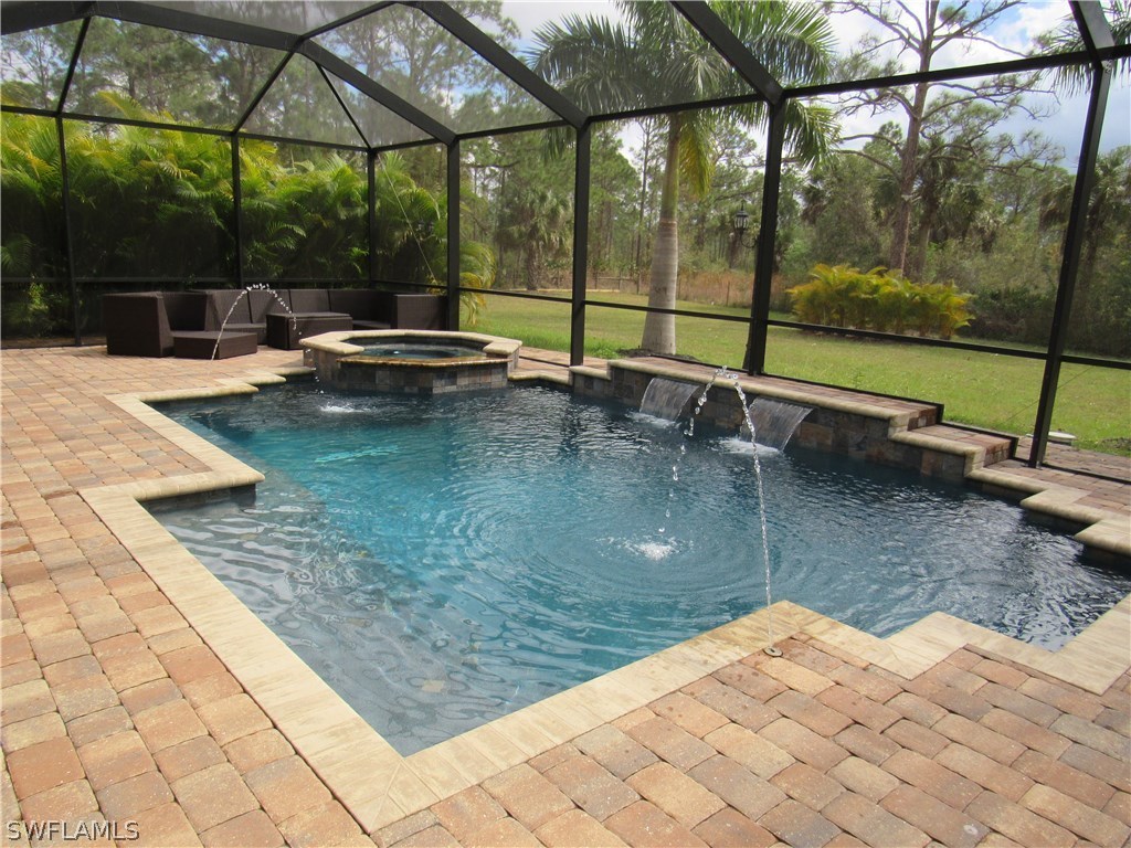 31031 Oil Well Road Punta Gorda, FL 33955 - Photo 19 of 22 a view of swimming pool with a patio