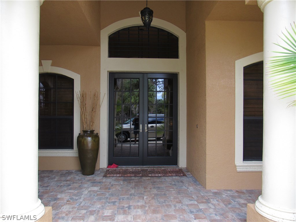 31031 Oil Well Road Punta Gorda, FL 33955 - Photo 3 of 22 a view of entryway with a front door