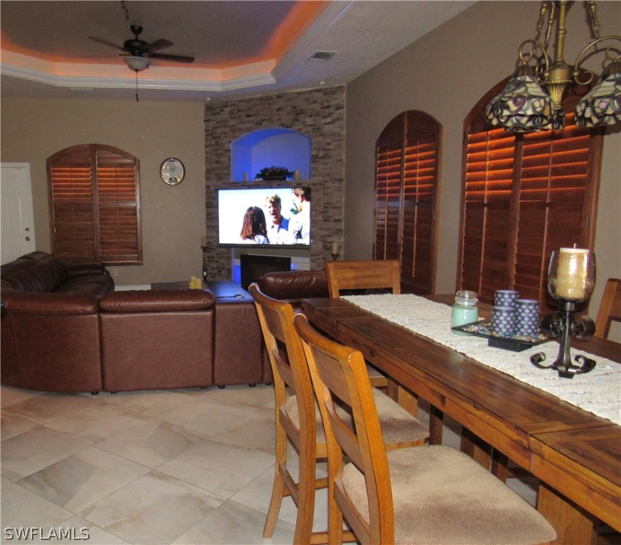 31031 Oil Well Road Punta Gorda, FL 33955 - Photo 5 of 22 a living room with fireplace furniture and a flat screen tv