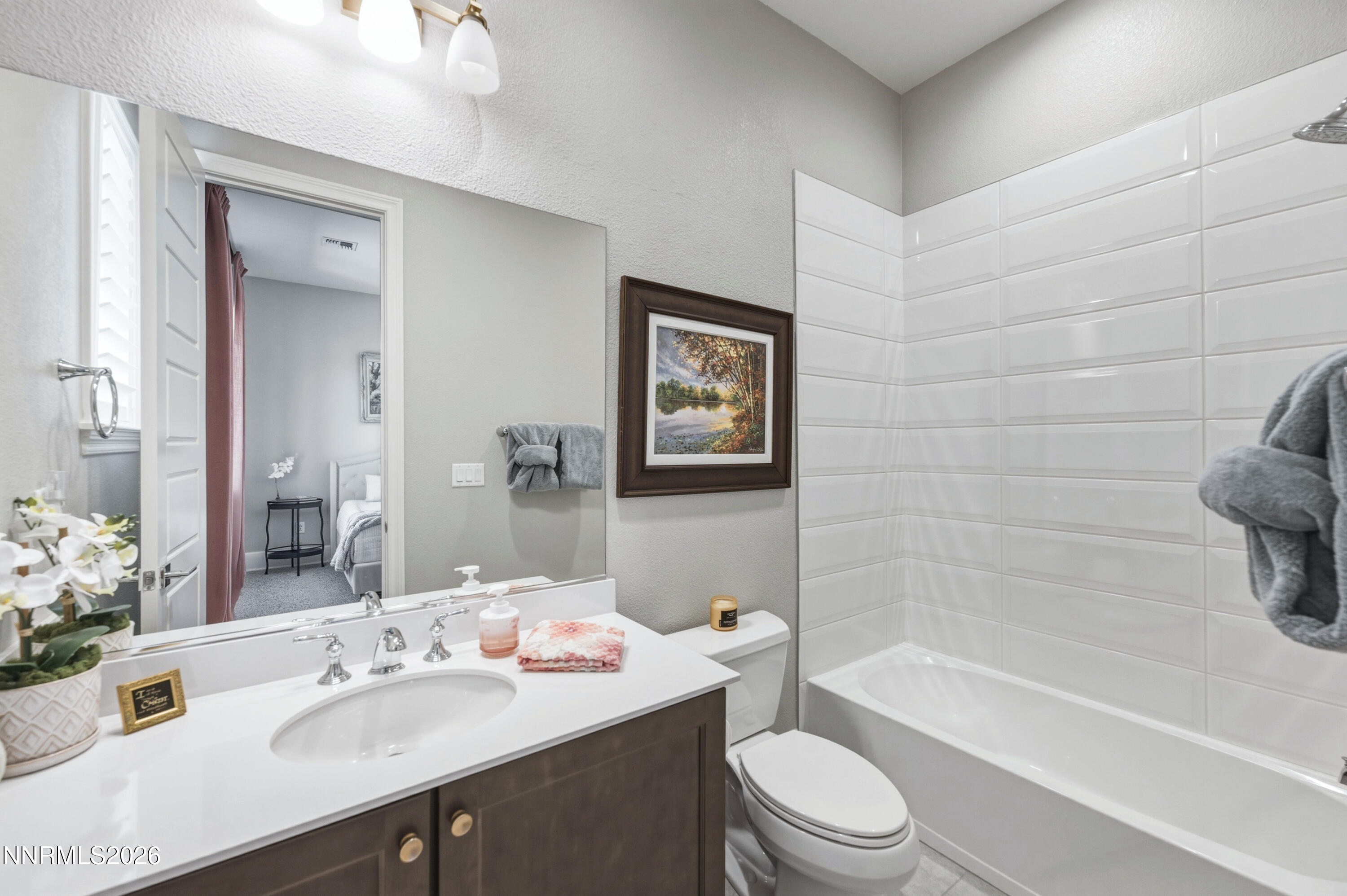 9028 Iron Sky Court Reno, NV 89523 - Photo 16 of 36 a bathroom with a sink a toilet and shower