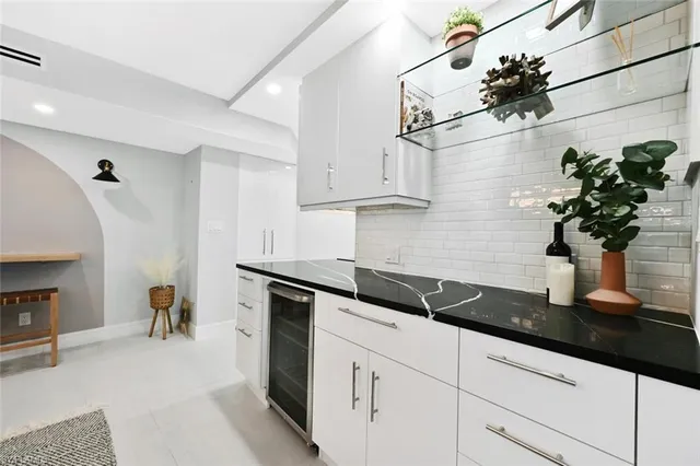a kitchen with a sink and cabinets