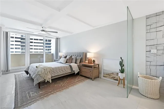 a spacious bedroom with a bed and a couch