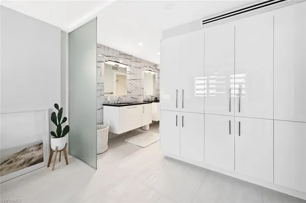 a bathroom with a sink and a large mirror