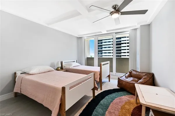 a bedroom with bed and a window