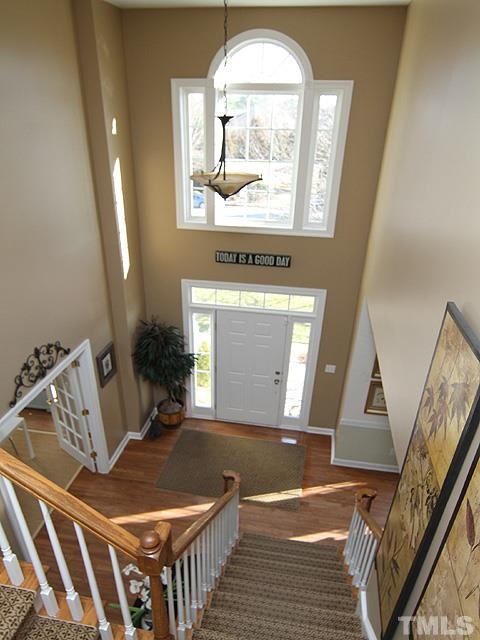 1508 Wood Spring Court Raleigh, NC 27614 - Photo 3 of 25 a view of a livingroom with wooden floor and furniture