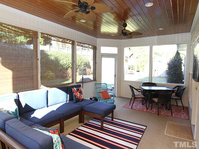 1508 Wood Spring Court Raleigh, NC 27614 - Photo 22 of 25 a living room with furniture a window and a table